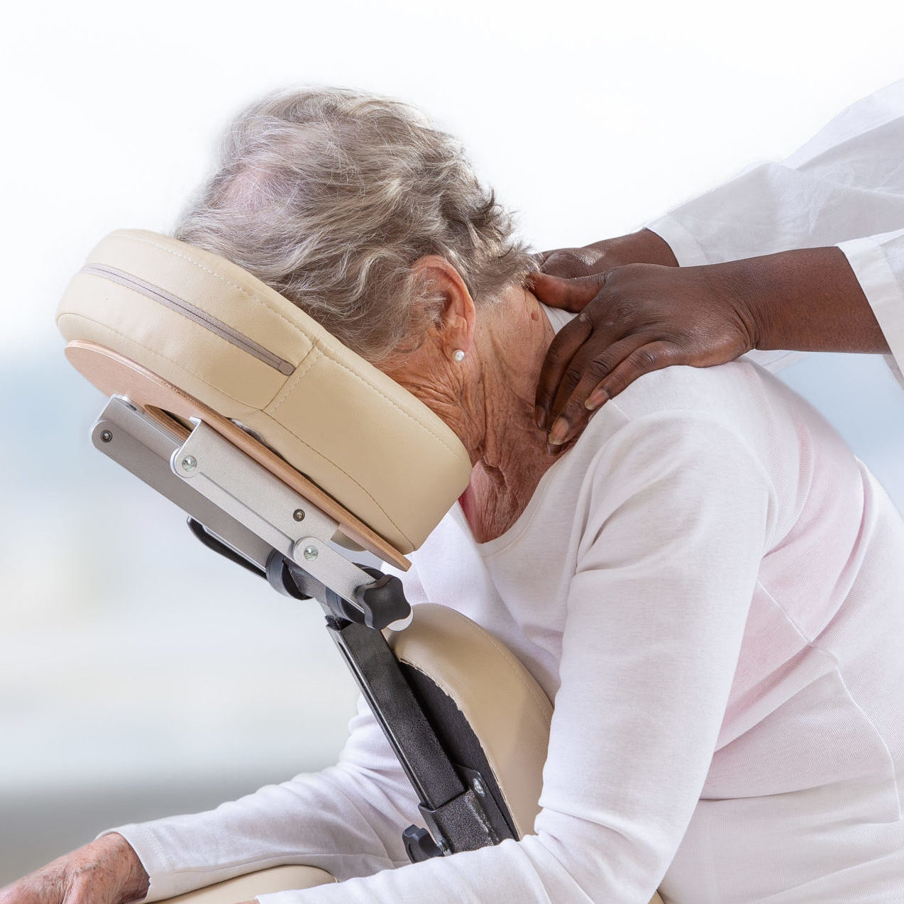 woman getting massage in chair. Calm, specialist