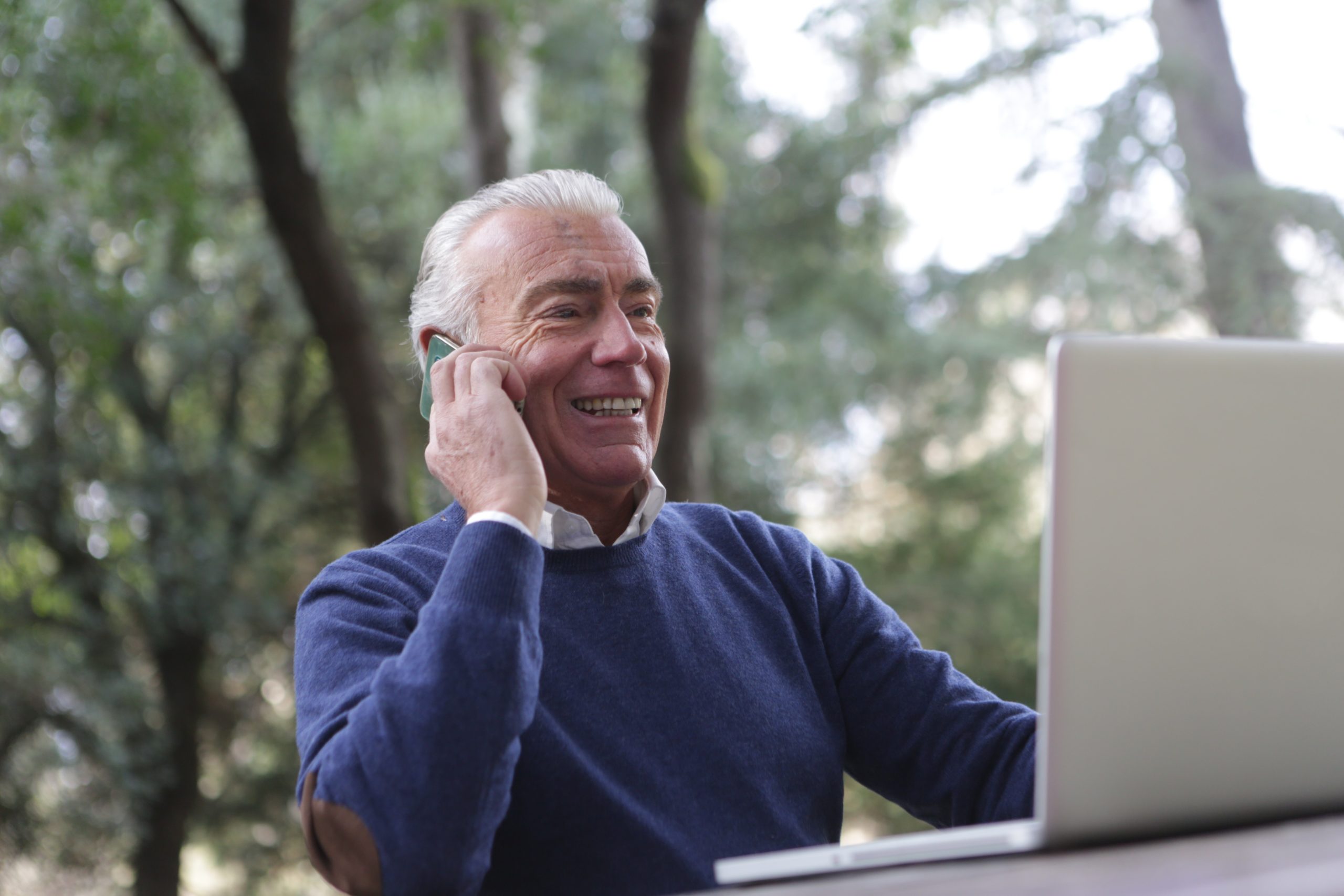 senior on the phone booking a massage